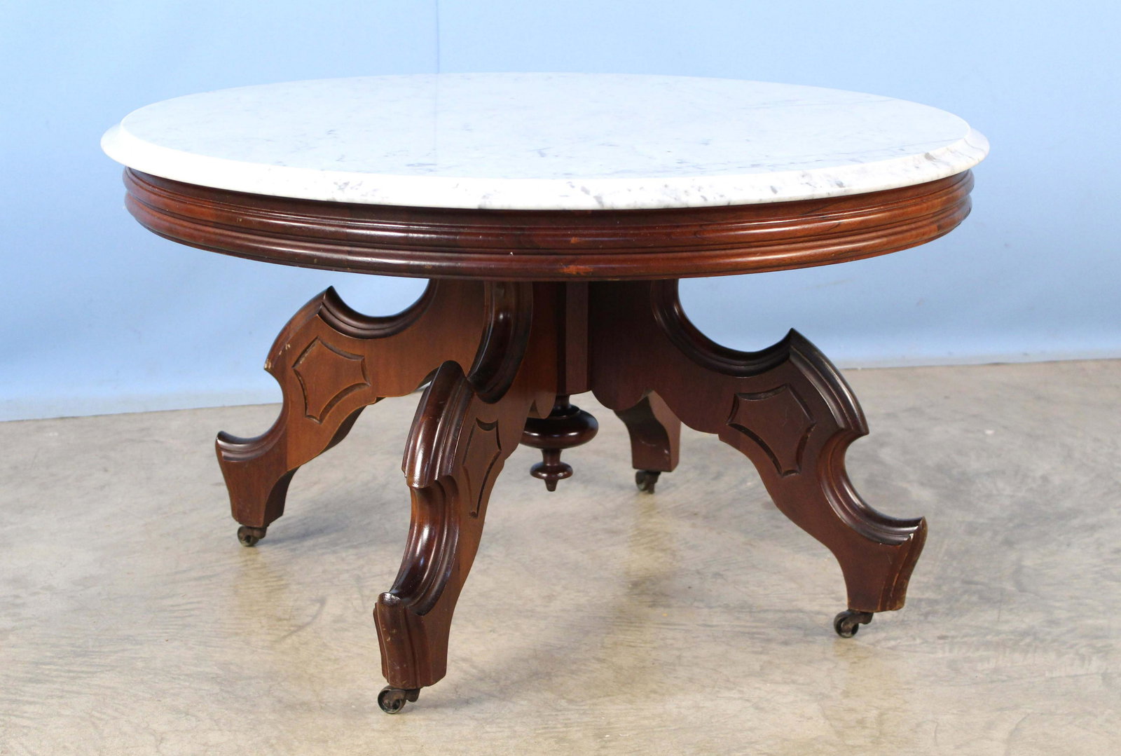 Victorian Walnut Marble Top Coffee Table: Victorian Walnut Marble Top Coffee Table. Table has been cut down to a coffee table height. Measures 18 5/8" high x 32 3/4" dia. Condition- Table is in overall good condition. See photos.