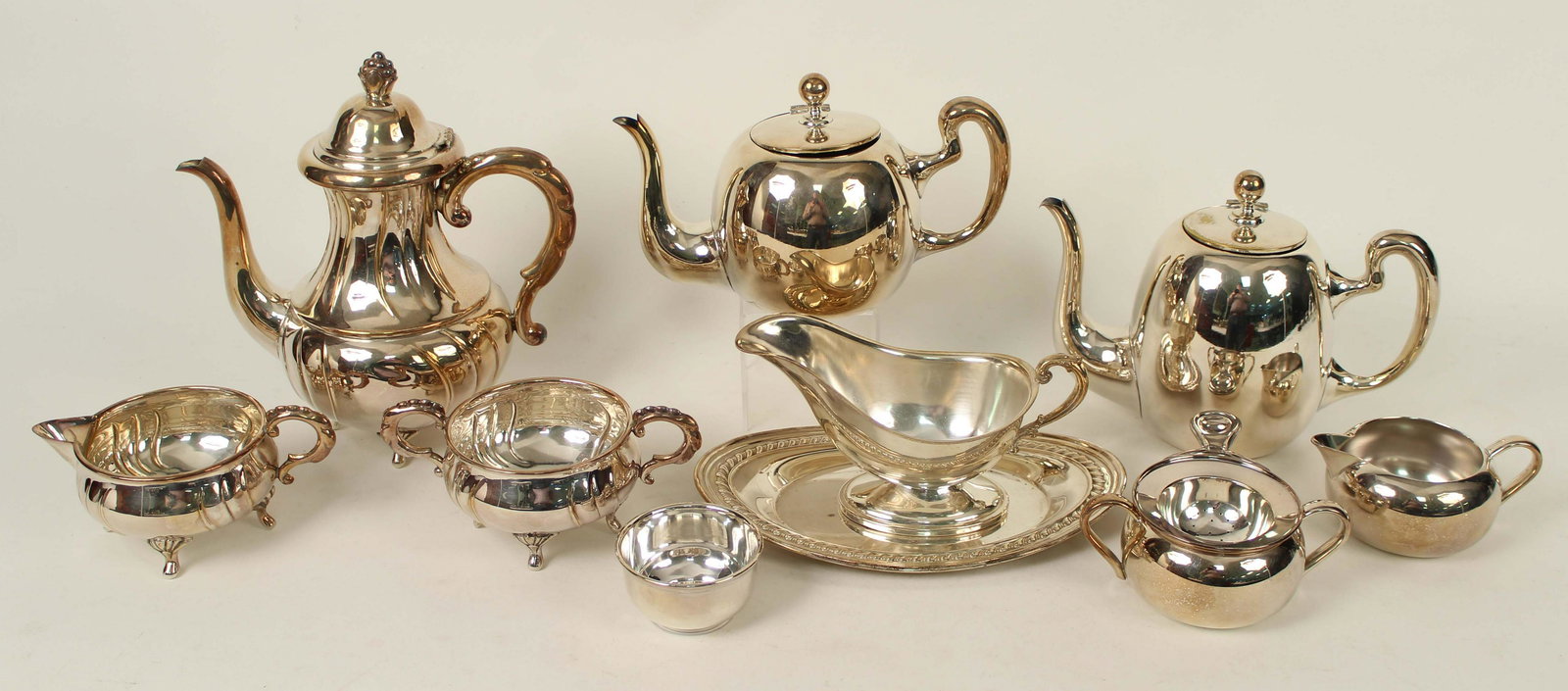 Nine Pieces of Silver Plate, Coffee/Tea Pot, Etc.: Nine Pieces of Silver Plate, Coffee/Tea Pot, Etc. (2) Coffee and teapot with a "PM" makers mark. Condition- Group has some plate loss and scratches. See photos.