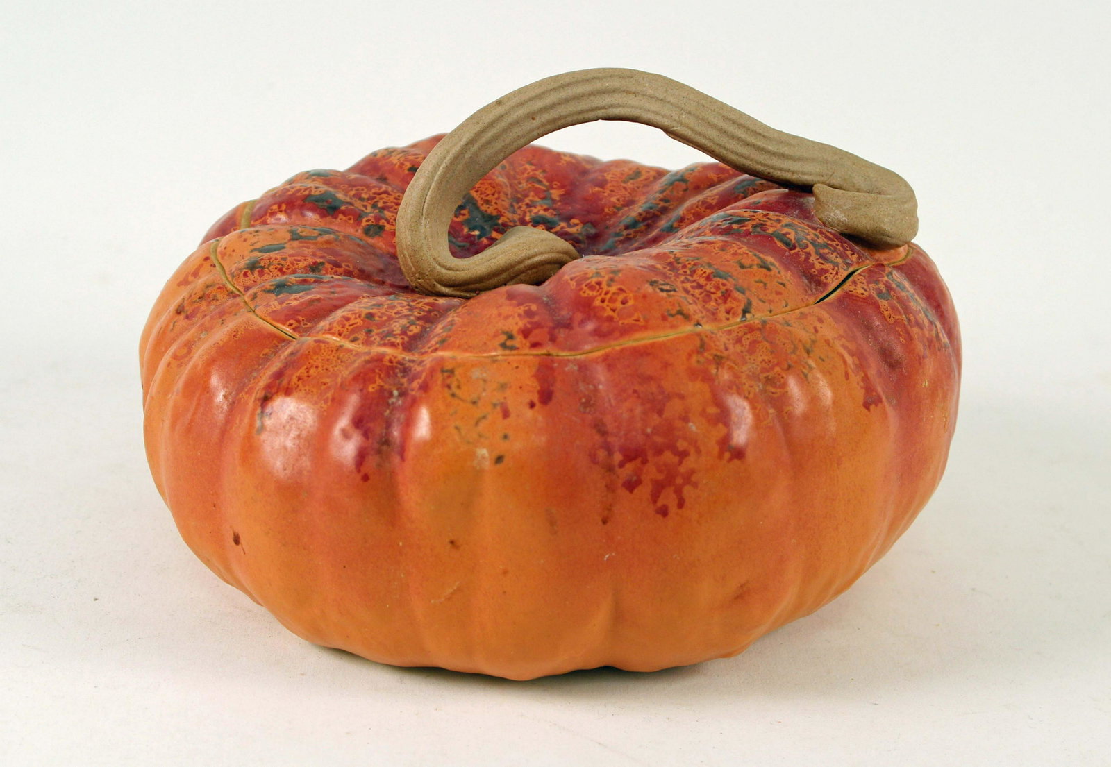Bauman Stoneware Pottery Large Pumpkin Cookie Jar: John Bauman Stoneware Pottery Large Pumpkin Cookie Jar. Measures 6" high x 10" dia. Condition- Cookie jar is in good condition. See photos.