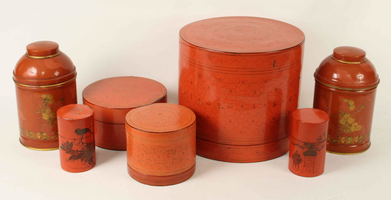 Italian Canisters & Chinese Paper Mache Boxes: Italian Canisters, Chinese Paper Mache Boxes, and Two Painted Chinese Tin Boxes. (2) Italian tin canisters cinnabar with gold trim. Labels on bases marked, "Made in Italy." Measure 8 5/8" high x 5 1/4