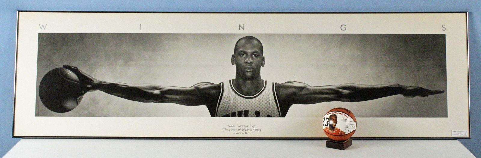 Framed Michael Jordan "WINGS" Poster & Ball: Framed Michael Jordan "WINGS" Poster and Ball. Frame measures 21 1/4" x 6' 3 1/4". (1) Wilson Michael Jordan mini basketball. Best Team Ever 72-10 Chicago Bulls. See photo of Michael Jordan personally