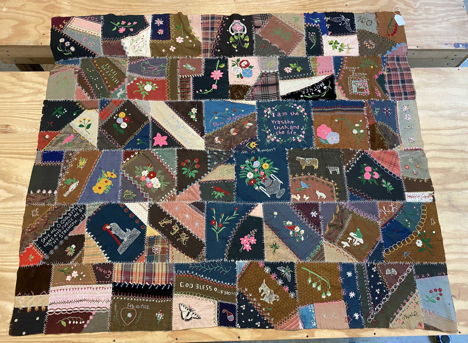 Mourning Crazy Quilt Top1903, Animals, Birds: Mourning Crazy Quilt Top Feb. 10, 1903, Animals, Birds. This West Tennessee Top measures 60" X 70". The top is briar stitched and decorated with "In Memory of Little Garnet", Dog picking up mail, butt