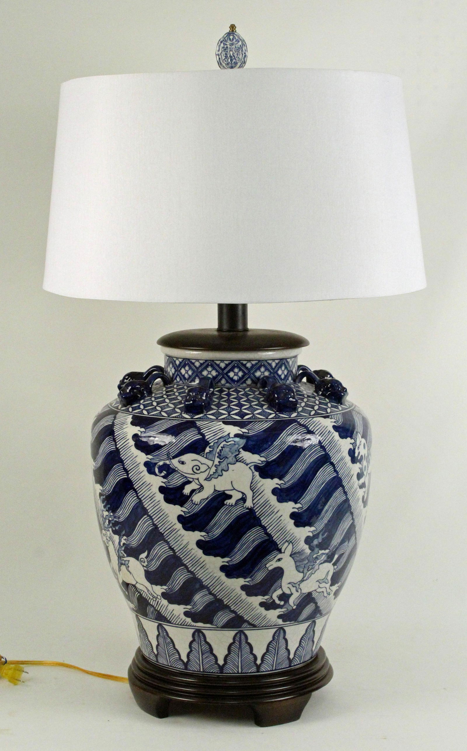 Frederick Cooper Chinese Style Blue & White Lamp: Frederick Cooper Chinese Style Blue & White Porcelain Lamp. The lamp is decorated with animals. The shade is not signed Frederick Cooper. Measures 33 1/2" High to finial top. The porcelain measures 15