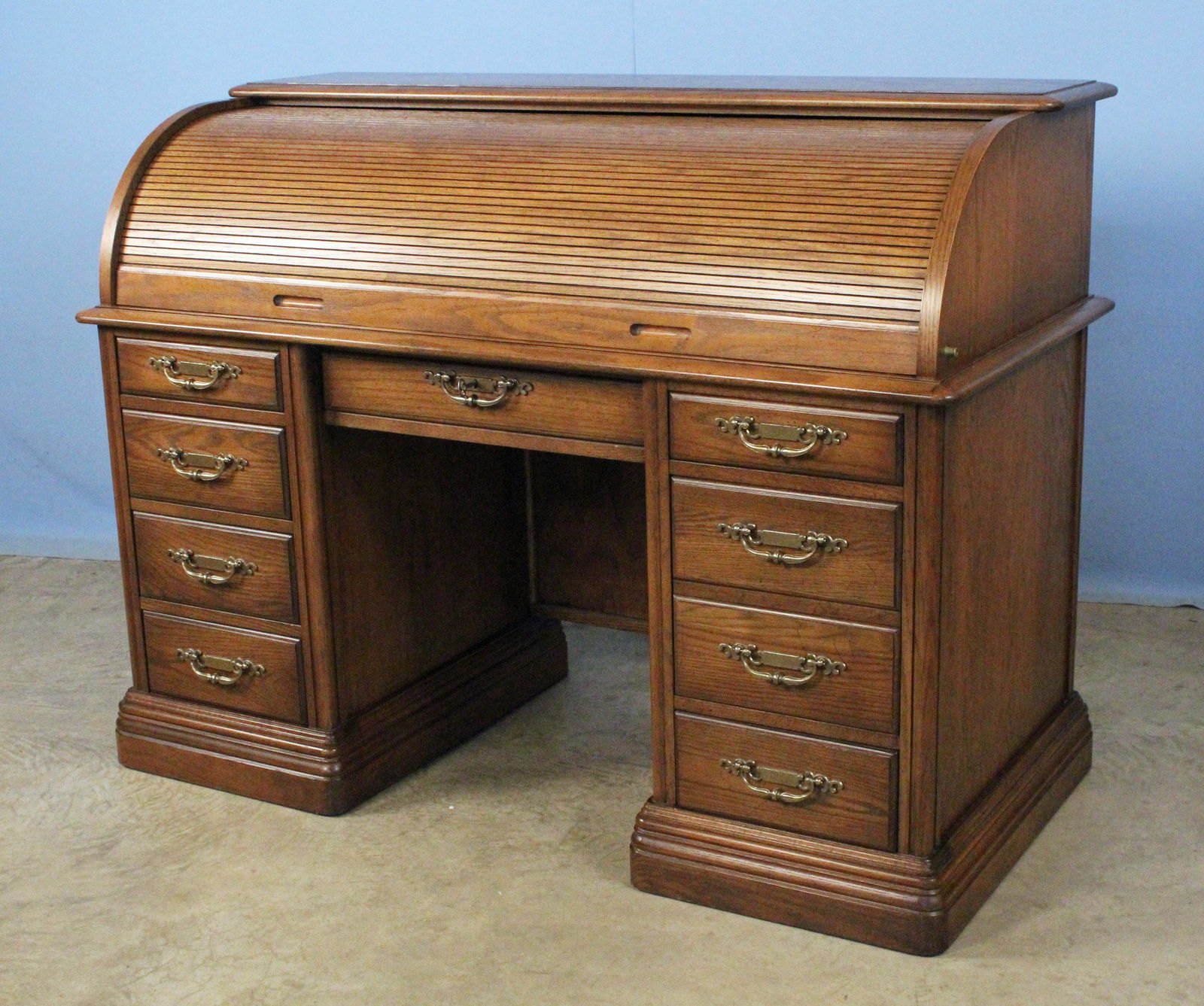 Jasper Oak Roll Top Desk w/ 9 Drawers (0124) on Mar 19, 2022 Kennedys Auction Service