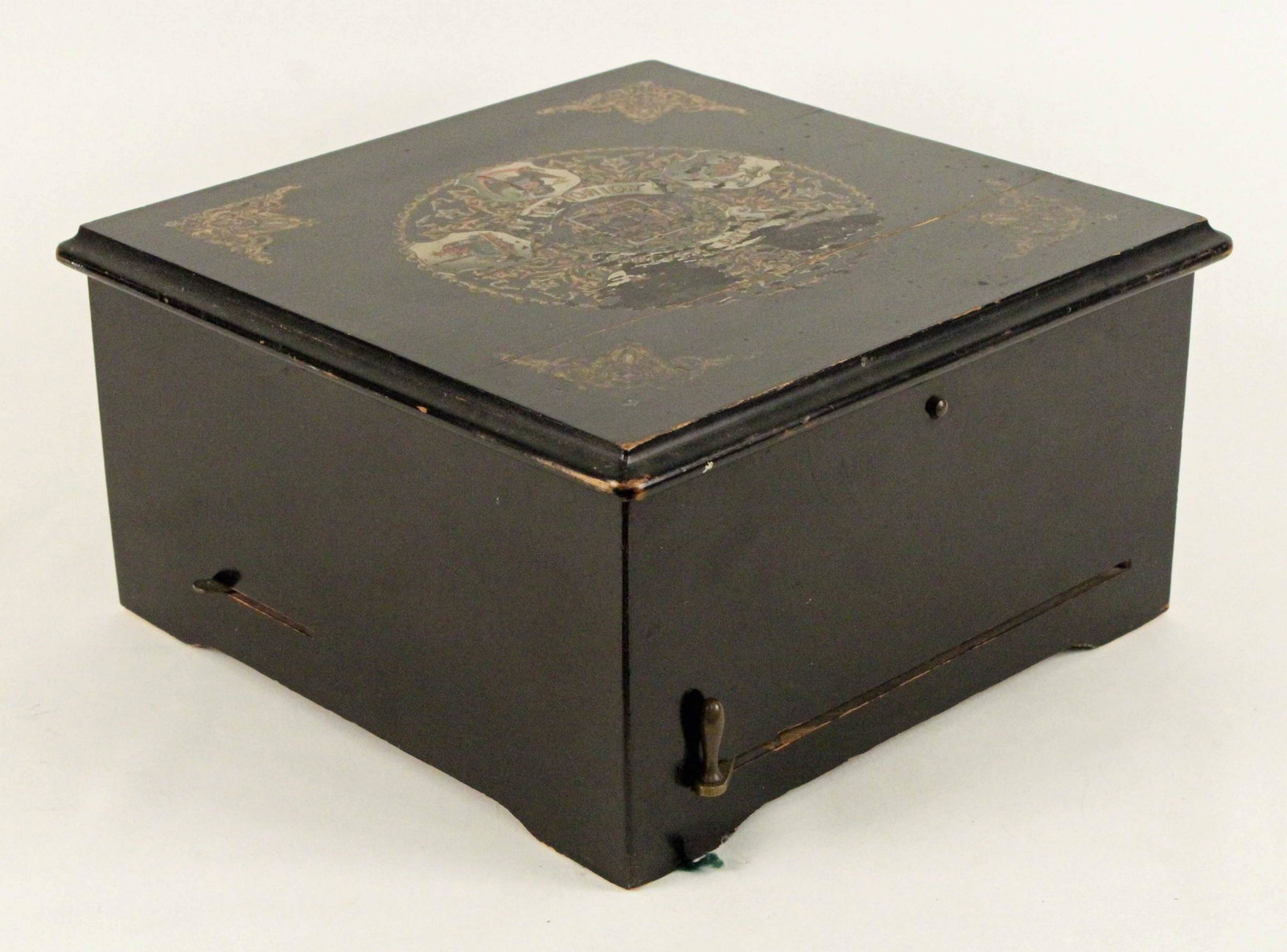 Symphonion German Music Box with Disc: Symphonion German Double Comb Music Box with Disc. Black ebonized case with scroll decoration and company seal. Measures 13 1/4" X 13 1/2". Condition - Worked fine at inventory. All teeth on both comb