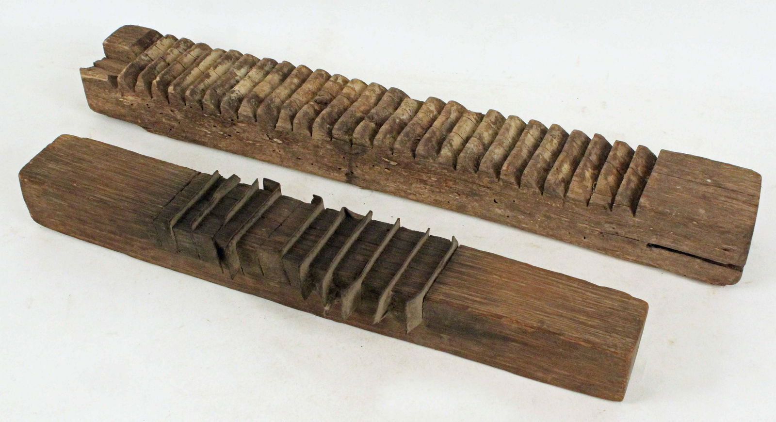 Two Early 19th C. Handmade Corn Shellers: Two Early 19th C. Handmade Corn Shellers. (1) Hand notched teeth corn sheller. Measures 27 1/4" long X 4" wide X 2 3/4" high. (1) Oak and heavy steel blade construction corn sheller. Measures 22 1/4"