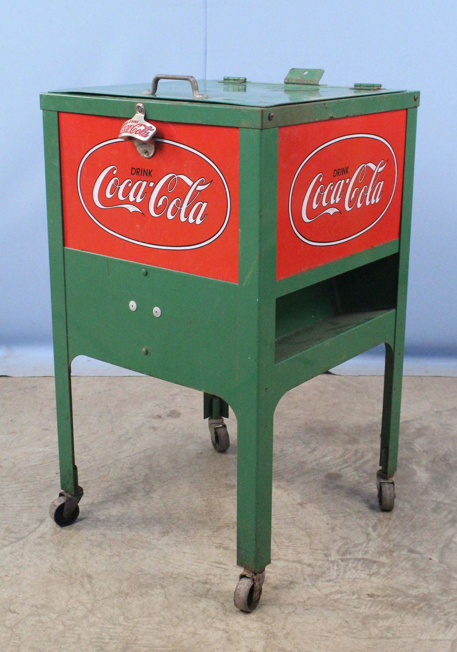 Repo. of Glascock Coca-Cola Ice Cooler: Reproduction of a Glascock Circa 1930 Coca-Cola Ice Cooler On Wheels. Measures 30 1/4" X 17 1/2" square. Condition- Cooler has some light surface rust, scratches, missing bottle cap catcher, etc. See