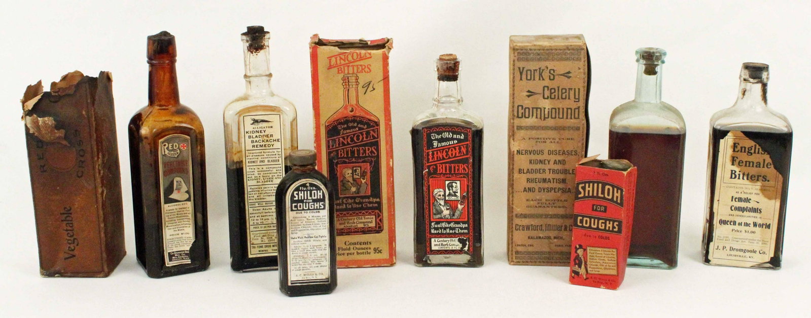 Group of Vintage Medicine Bottles: Group of Vintage Medicine Bottles. (1) Red Cross Vegetable Compound, For "All Female Weaknesses." Co-Operative Drug MfG. Co., Jackson, Tenn. with the original box. (1) Lincoln Bitters tonic bottle and
