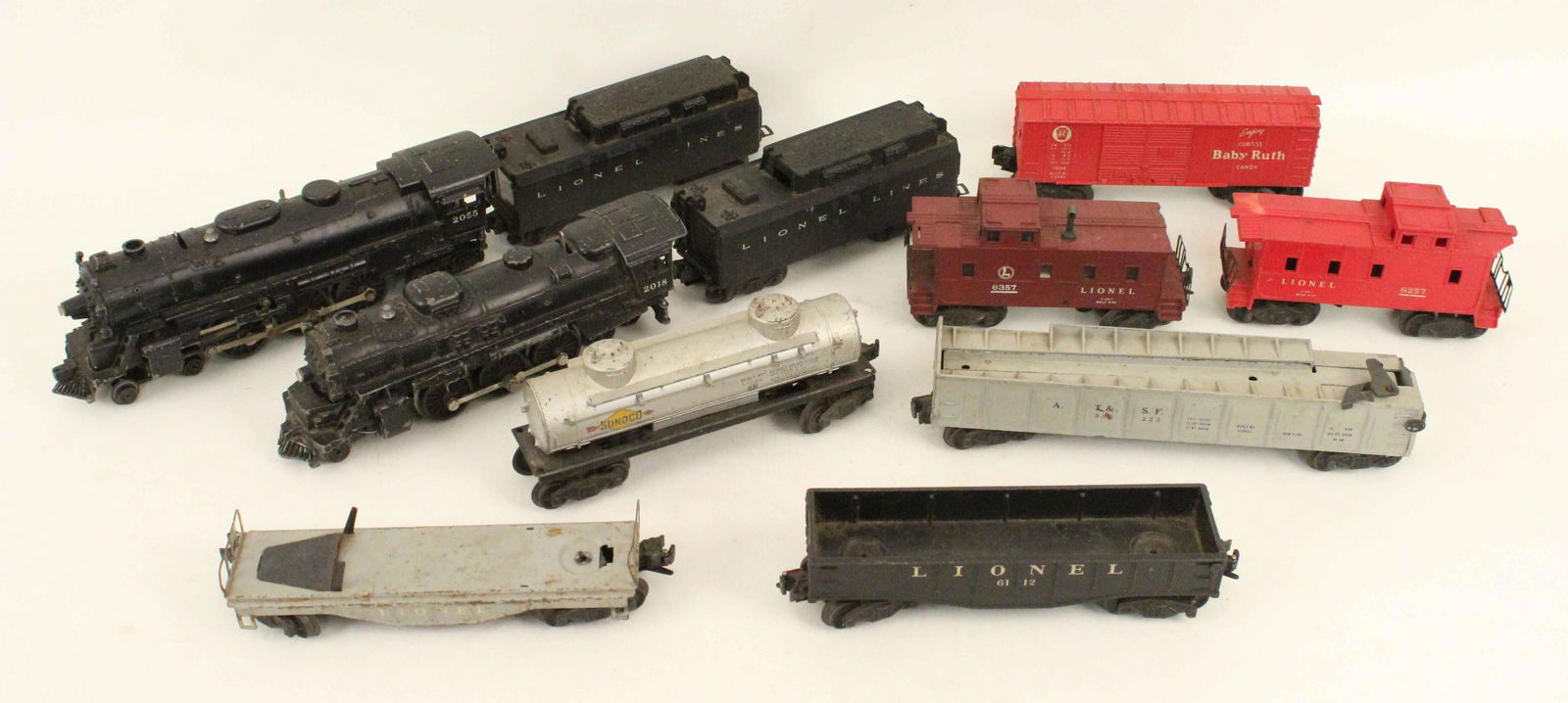 Lionel 2055 & 2018 Engines and 9 Cars: Lionel 2055 & 2018 Engines and 9 Cars. Condition - The two gray cars might be missing parts. All cars and engines have wear. Engines have not been tested. One caboose is missing corner of roof.