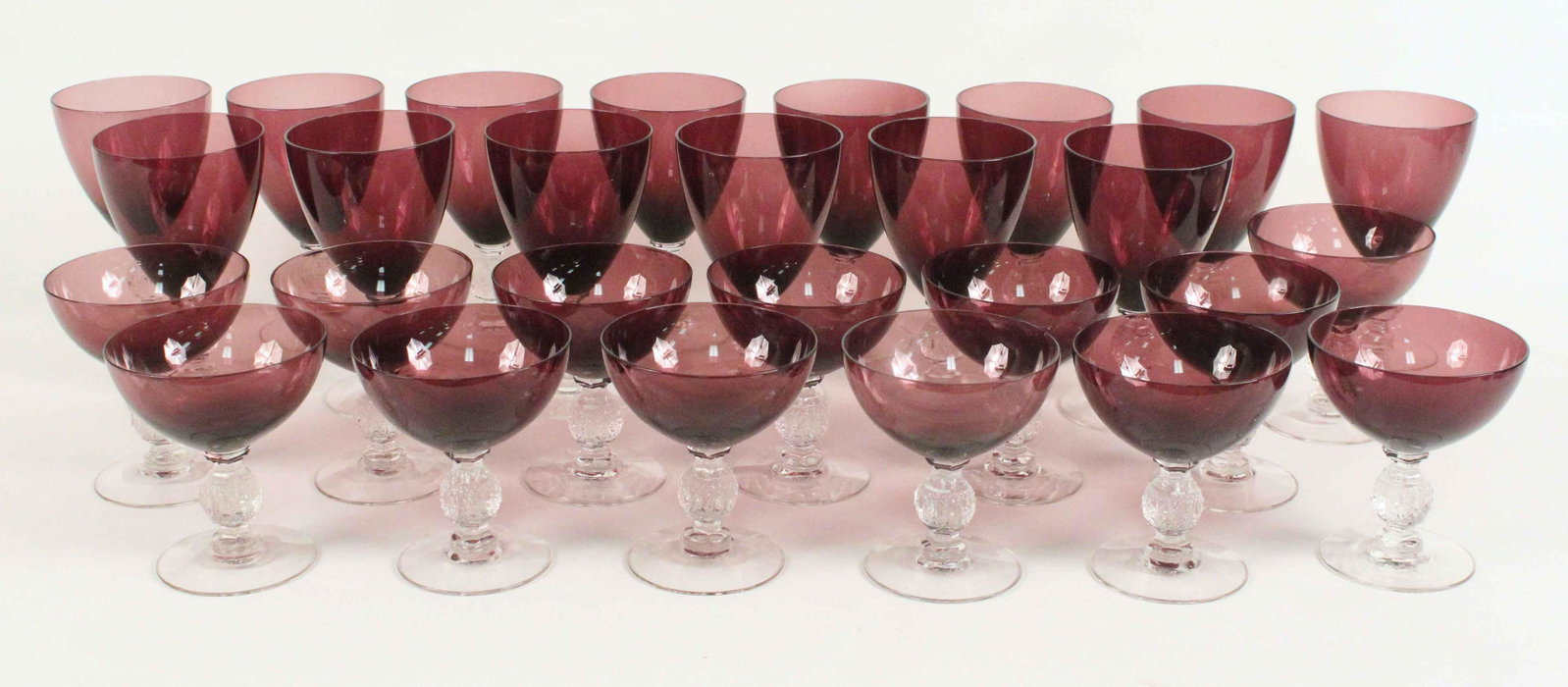 27 Cambridge Aurora Amethyst Stemware: 27 Cambridge Aurora Amethyst Stemware. (14) 6 1/4" high water goblets. (13) 4 1/2" champagne/tall sherbets. Provenance: Jan Grady Living Estate Corinth, Mississippi. Condition- 24 pieces are in good c