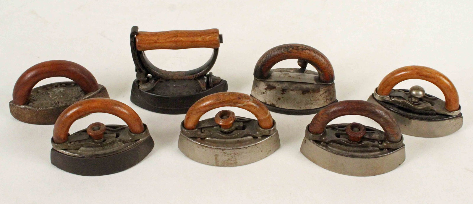 7 Toy Sad Irons w/ Wooden Handles (1 of 4)