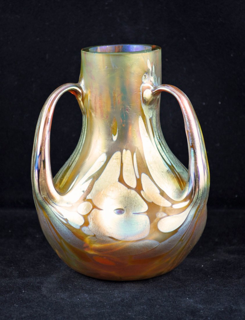 Loetz Phänomen Genre 1/473 Vase w/ 3 Handles: Loetz Phänomen Genre 1/473 Vase w/ 3 Handles boldly etched "Loetz / Austria" on the base, three-handled form in iridescent gold glass with Phenomen decoration 5.5" tall.
