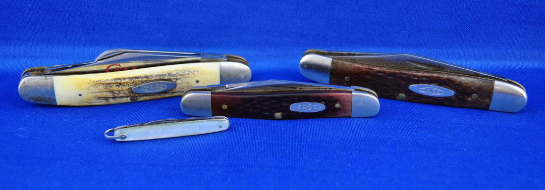 Four Case XX Pocket Knives: Case XX circle C stag handle stockman knife with three blades; Case XX U.S.A. two blade pocket knife no. 6247; Case XX U.S.A. two blade no. 6208 SS; and miniature mother of pearl pocket knife 1-7/8" ,