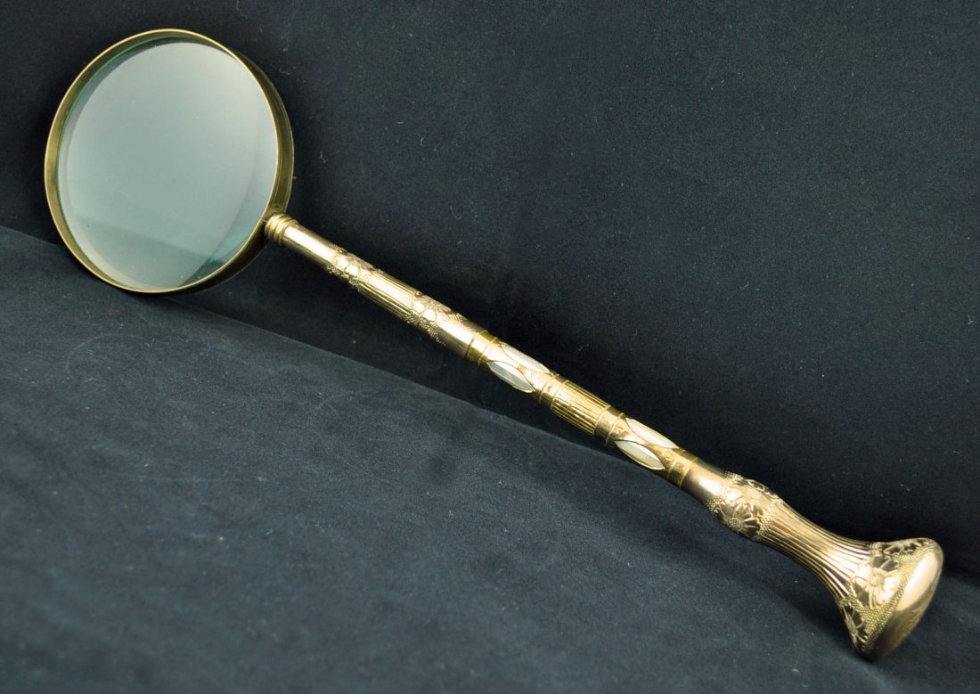 Mother-of-pearl Gold-finished Magnifying Glass: Victorian mother-of-pearl gold-finished magnifying glass. 17 inches long.