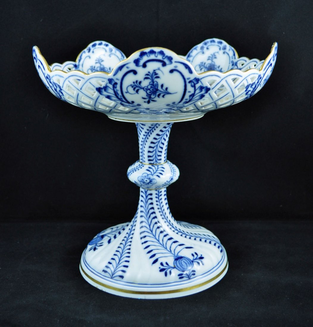 Meissen Compote Blue Onion Decoration: MEISSEN COMPOTE. Blue Onion decoration with a reticulated bowl and swirled base. Marked "blue crossed sword mark. 9"d. 9"h.