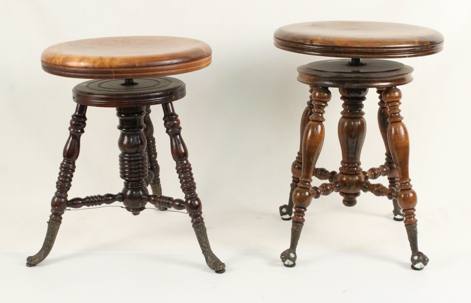 Two Antique Organ Stools with Turn Tops: Two Antique Organ Stools with Turn Tops. (1) Measures 18 1/2" High (1) Measures 19 1/4" High. Condition- Overall good condition. One stool has wire at base for support and small separation crack in se
