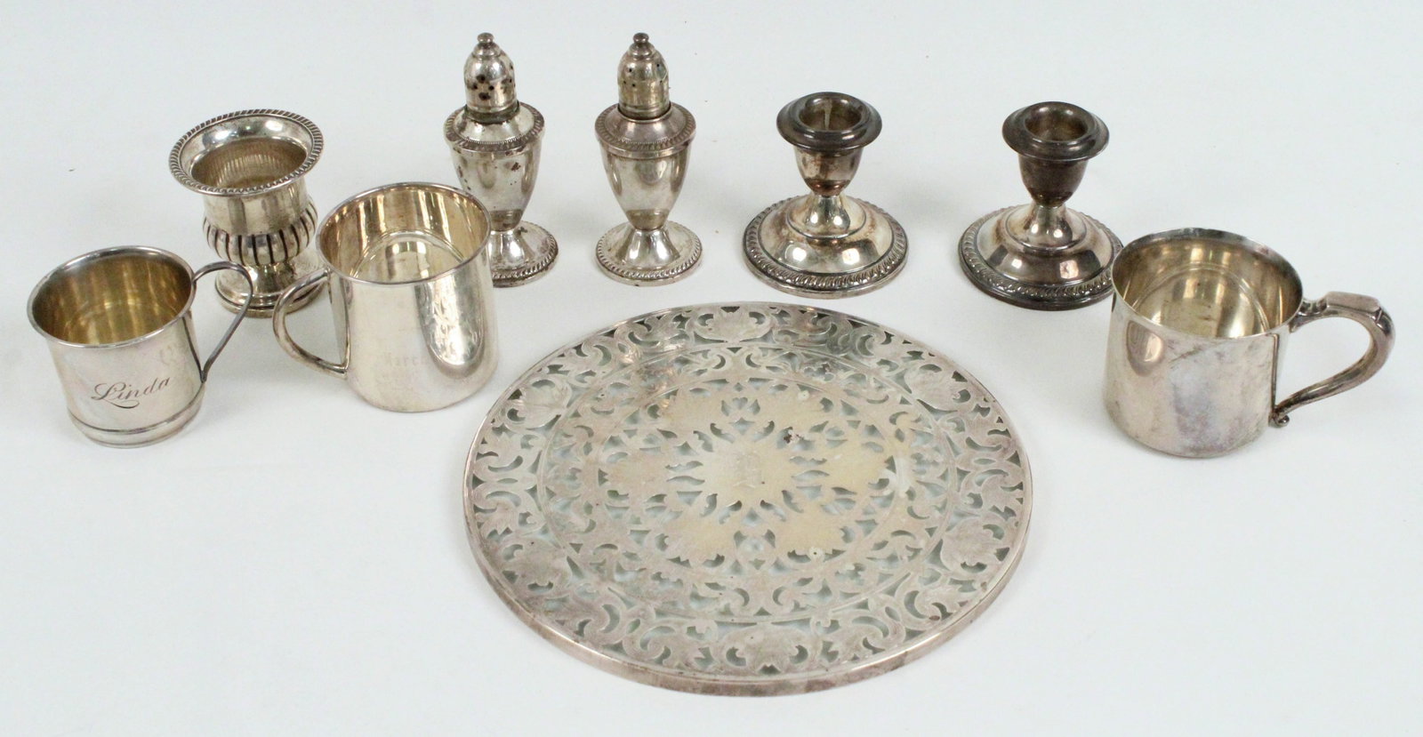 Sterling Silver Baby Cups, Shakers, Candle Holders: Sterling Silver Baby Cups, Shakers, Candle Holders, Etc. (3) Baby cups. Smallest cup is engraved, "Linda." The middle sized cup is engraved, "Jack March 30th 2004." A very heavy baby cup is not engrav