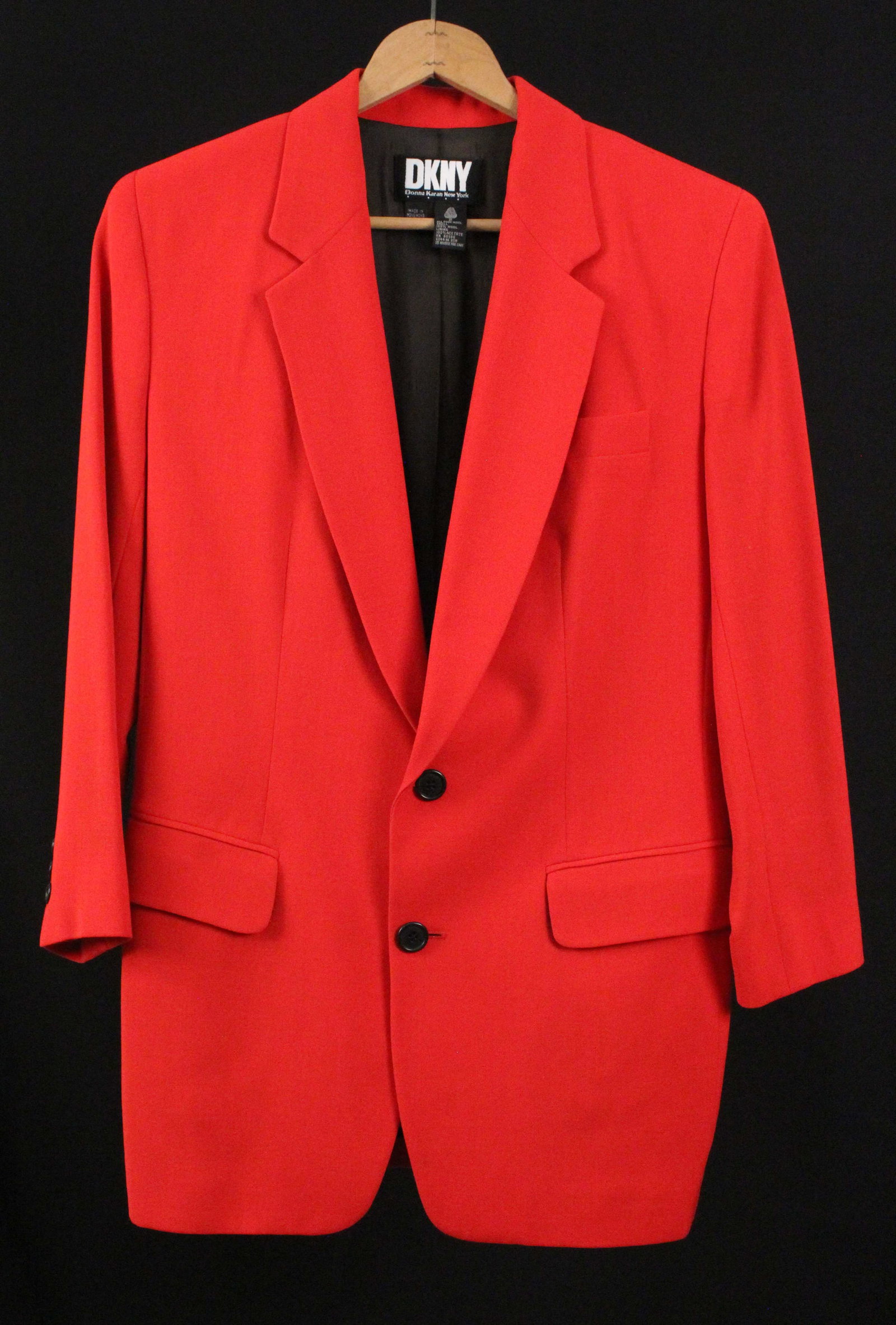 Donna Karan Ladies Red Wool Blazer: Donna Karan Ladies Red Wool Blazer. Material: 100% Wool. Labeled, "DKNY; Donna Karan New York." According to the family of the owner, most of the dresses in their collection are approximately size 6-8