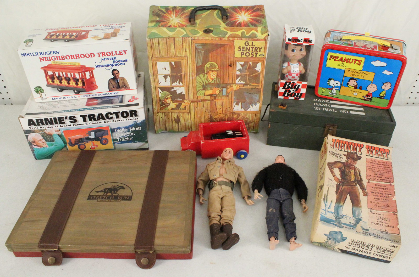 Toys, G.I. Joe's, Mr. Rogers, Peanuts, Etc.: Toys, G.I. Joe's, Mr. Rogers, Peanuts, Etc. (3) 1964 G. I Joe figures. (1) Jane West figure. (1) Johnny West figure. (1) G. I. Joe accessories. (1) Arnie's Tractor replica of Arnold Palmer's golf cour