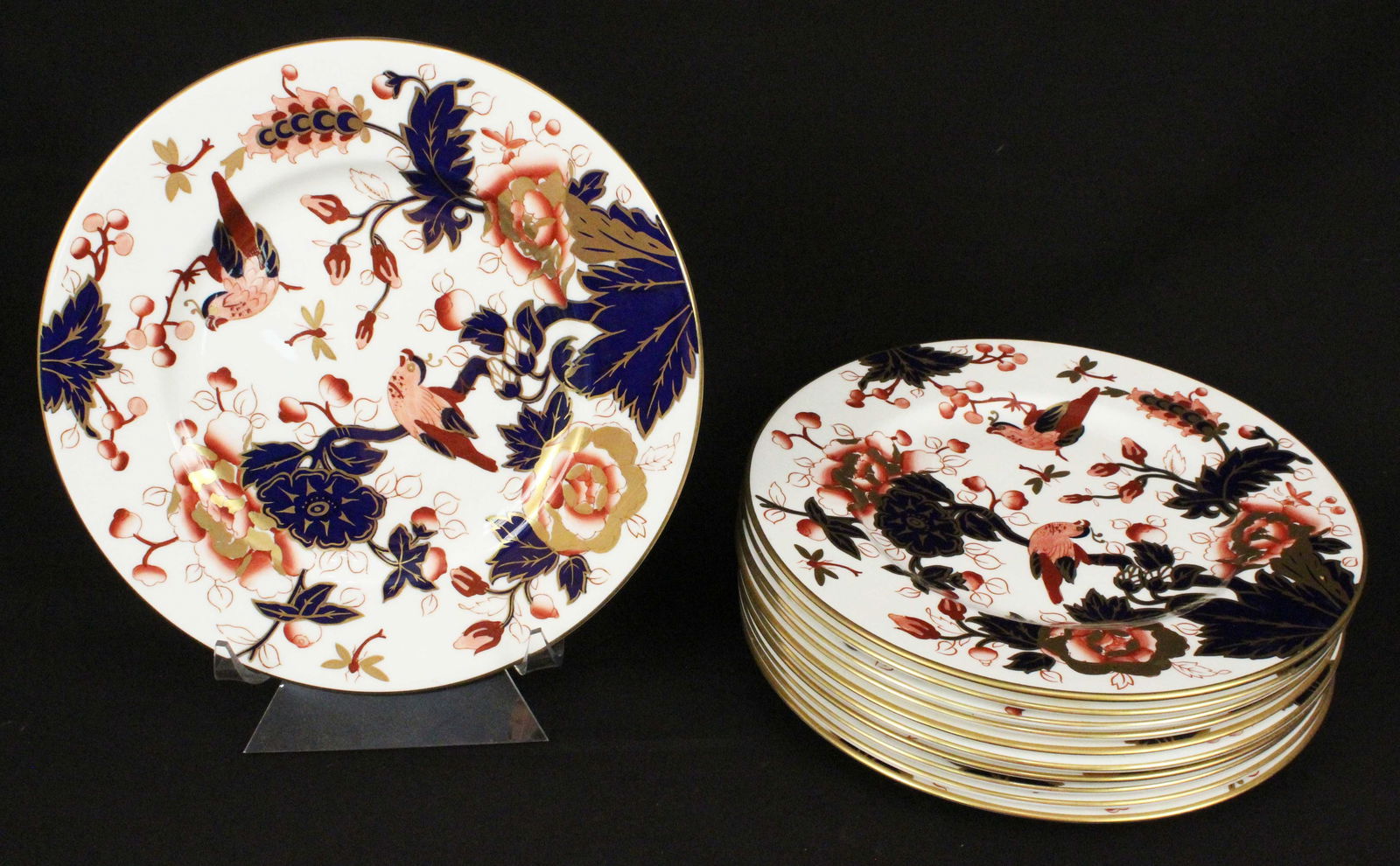 (11) Cold Port Hong Kong Mauve Flowers Plates: (11) Cold Port English Hong Kong Mauve Flowers Bone China 10 3/4" Dinner Plates. Beautiful plates with gold gilt, cobalt, and floral decorations. Condition- Good condition. See photos.