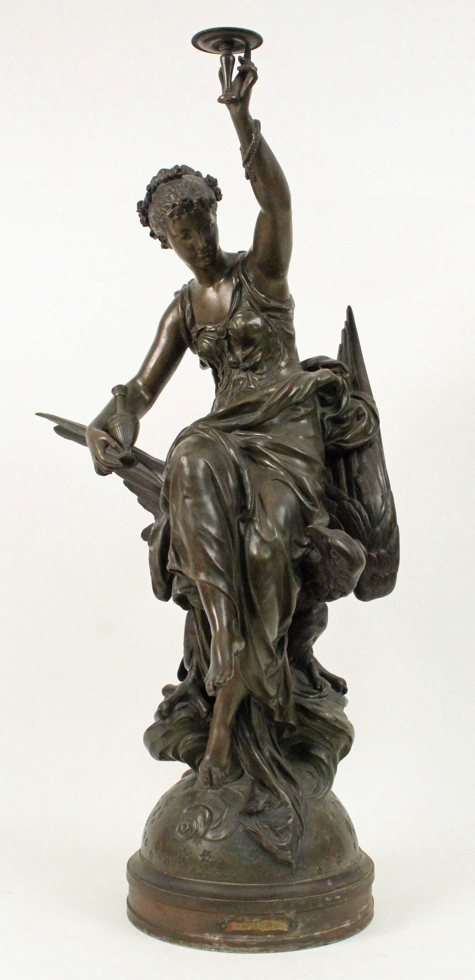 Henry Dumaige (1830-1888) "Hebe" Figure: Henry Etienne Dumaige (French 1830-1888) "Hebe" Figure. Depicts the Greek Goddess Hebe riding an eagle perched on Jupiter. Label on base reads, "Hebe; Par Dumaige (Sculptr.)" This is a circa 1900 whit