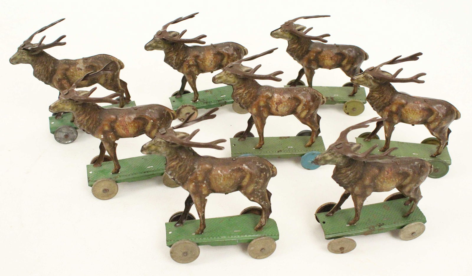 (8) Penny Toy Tin Elk On Wheels: (8) Penny Toy Tin Elk On Wheels. Measure 4 1/2" high X 4" long. Condition- Most are in very good condition with some minor wear and losses to paint. A few have minor breaks to tin. See photos.