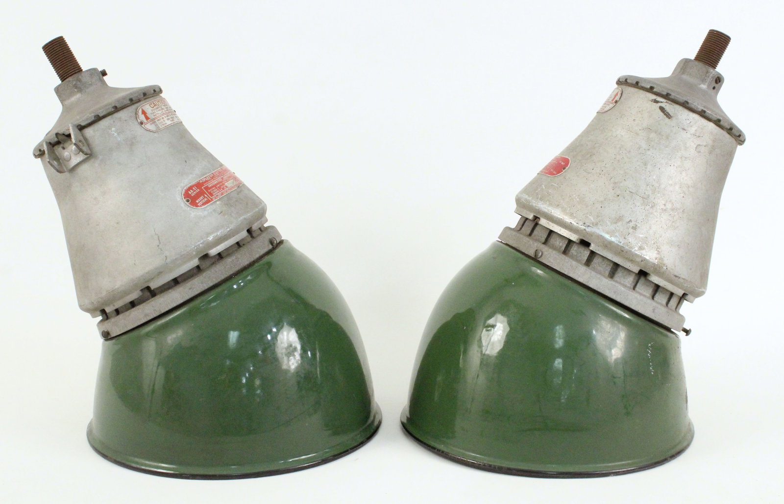 Pair of Appleton Electric Industrial Green Lights: Pair of Appleton Electric Industrial Green Porcelain Gas Station Lights. Measure approximately 13 1/4" high X 10" diameter (shade). Provenance the remaining inventory of Antique Archaeology, closed Na