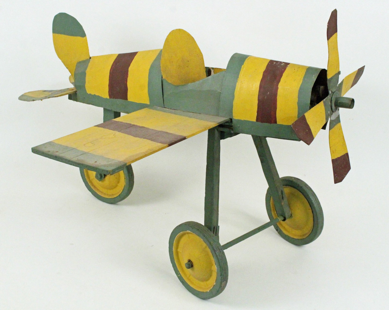 Folk Art Airplane with Fan Motor: Folk Art Airplane with Fan Motor. Wood and metal construction. This plane is being sold for decorative purposes only. Should not be used as a fan because of blade hazard. Wings are constructed from wo