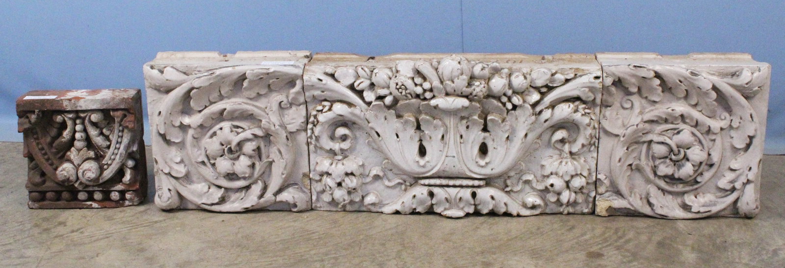 1890's Tile Architectural Facade Parts: 1890's Tile Architectural Facade Parts. (1) Largest piece with an acanthus leaf bowl with fruit decoration, 12 3/4" high X 23 5/8" wide X 6 3/4" deep. (2) Pair of matching blocks with acanthus leaf de