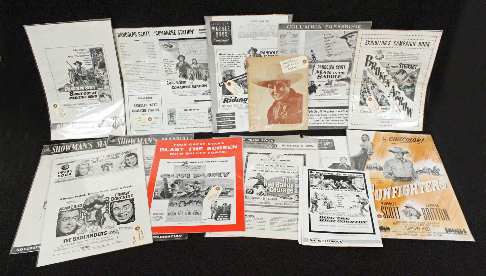 Group of Western Film Pressbooks: Group of Western Film Pressbooks. (1) 1953 "Gun Fury" pressbook. Starring Rock Hudson, Donna Reed, Phil Carey, and Roberta Haynes. Measures 12" X 16". (1) 1947 "Gunfighters" pressbook. Starring Randol
