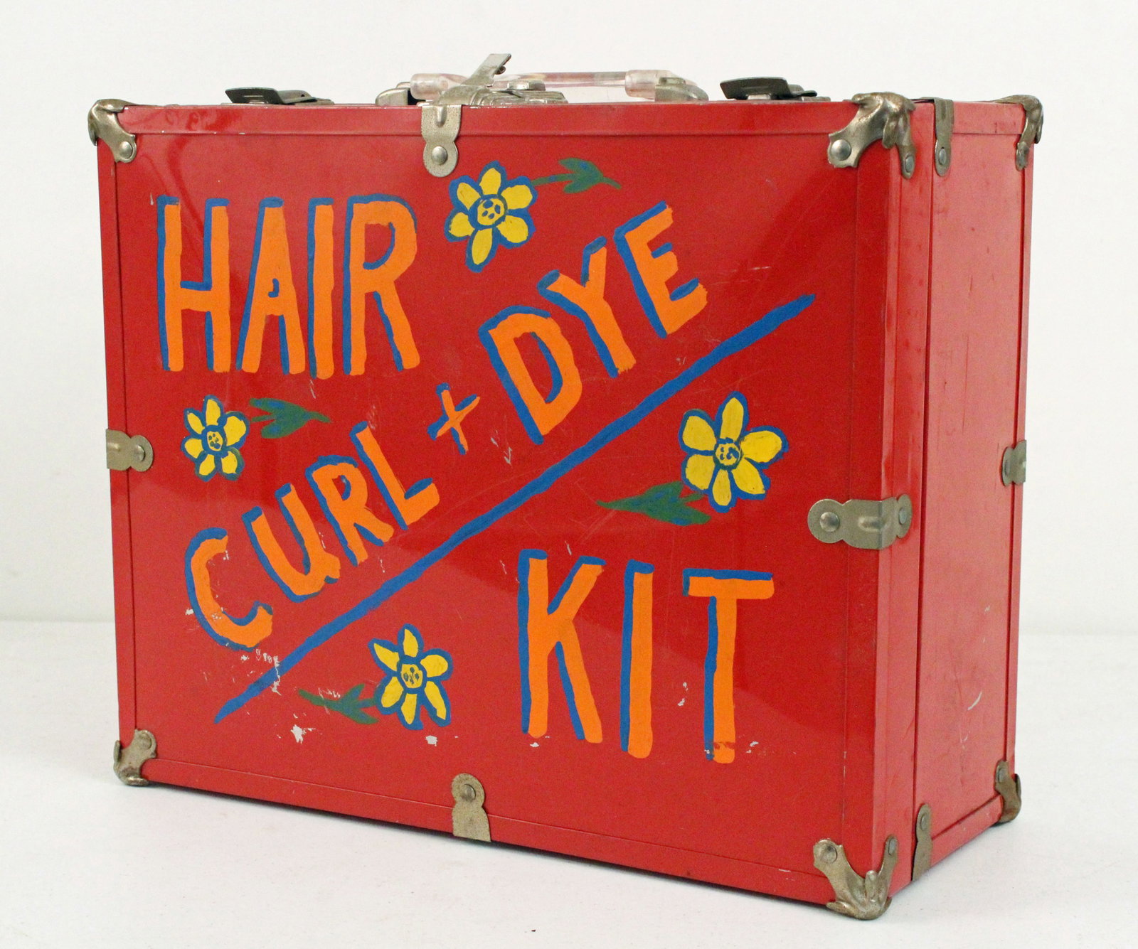 1950's Decorated Hair Curl & Dye Kit Case: 1950's Decorated "Hair Curl + Dye Kit" Case with Handle. Handpainted and decorated with flowers. Measures 6 3/4" deep X 12 3/4" wide X 15 3/4" long. The case has no contents. Provenance the remaining 