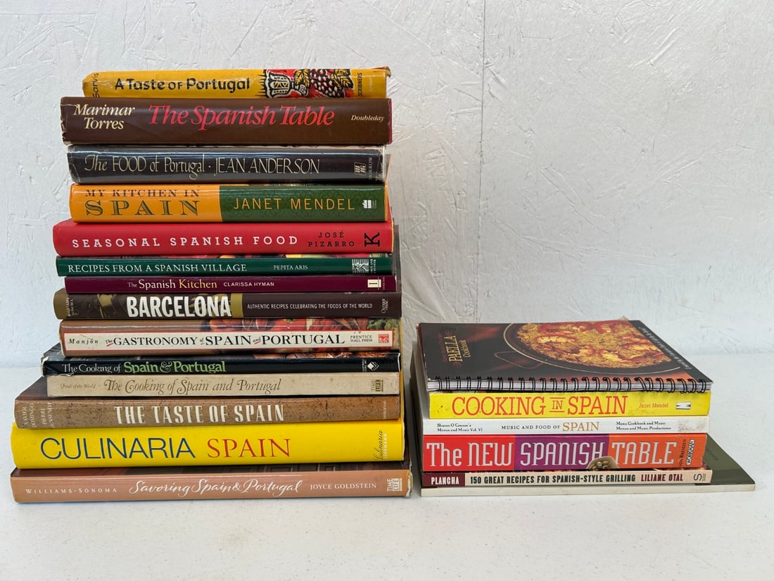 20 Spanish and Portuguese Cookbooks: Lot contains 6 softcover and 14 hardcover titles covering the gastronomy of Spain and Portugal. Combined lot measures approximately 21"x13"x10".