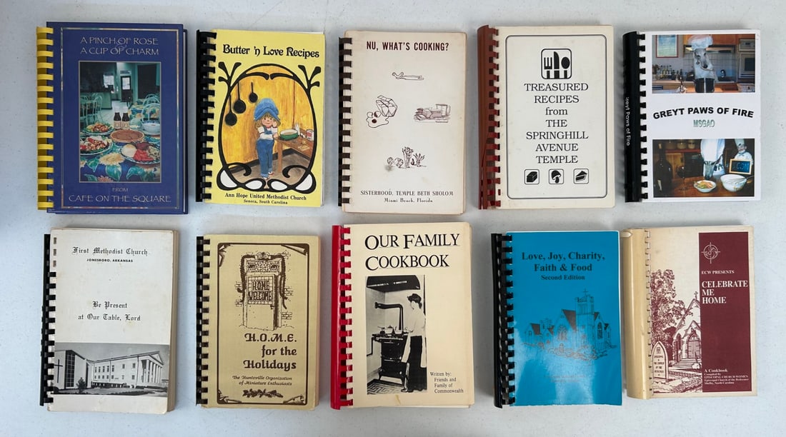 29 Spiral bound Southern States Cookbooks: Lot contains 29 spiral bound cookbooks primarily published by churches and Junior Civic Leagues in the South. Combined lot measures approximately 19"x9"x19".
