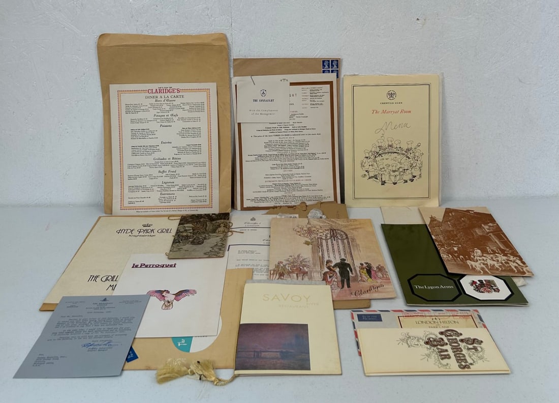 12 London and UK Restaurant Menus and Ephemera: 12 London and UK Restaurant Menus and Ephemera c. 1980's including 1 St. George's Bar at the London Hilton accordion fold laminated paper menu in original mailing envelope dated 1987; 1 Kensington Gri