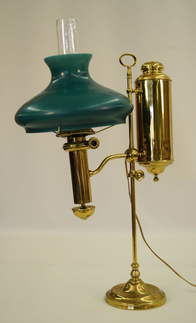 Antique Brass Student Lamp with Green Shade: Antique Brass Student Lamp with Green Shade. Lamp has been electrified. Lamp burner is marked Sun Lamp. Dimensions - 28" h. with chimney and 25.25 lamp only, shade 11.5" Dia.
