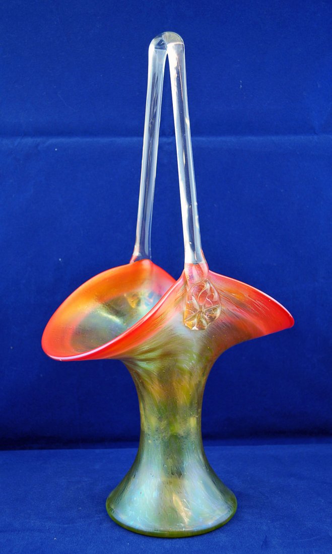 Unsigned Loetz Rindskopf Grenada Art Glass Basket: Unsigned Loetz Rindskopf Grenada Art Glass Basket, gold body with variant shading to a reddish-orange or tomato red rim with clear handle. 14" High and 7.5" X 4.75" diameter.