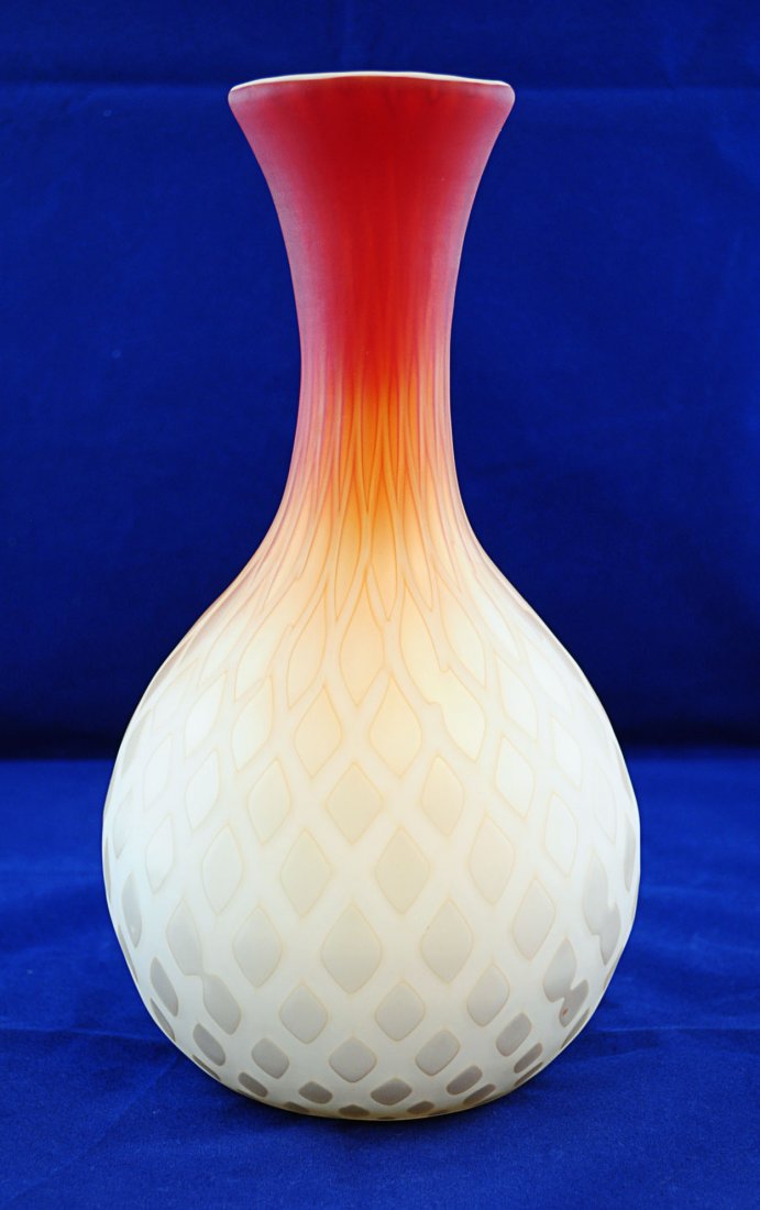 Peachblow Diamond Quilted Satin Glass Vase: Peachblow Satin Glass Vase, late 19th c., probably Thomas Webb and Sons, bottle vase form in white glass cased in peach shading to gold mother-of-pearl glass in diamond quilt pattern. 11"H. X 5.5" dia