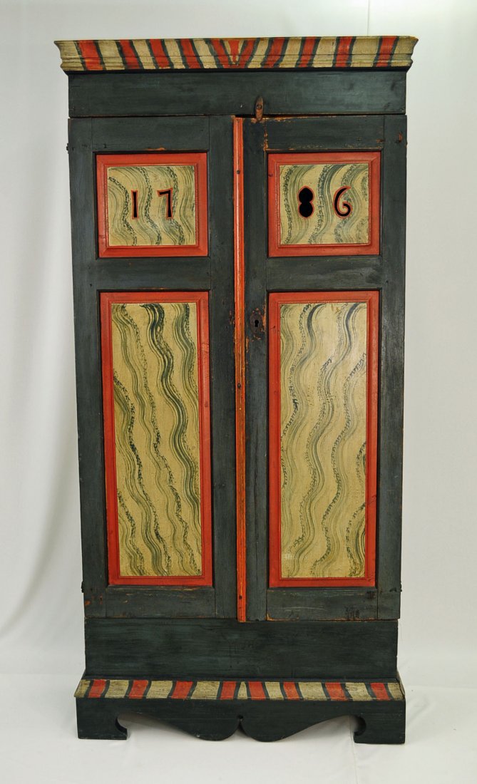 Late 18th Century Painted Pine Wall Cupboard: Late 18th Century Painted Pine Wall Cupboard. The date 1786 pierce carved in top panels of raised panel doors. Blanket chest in base. Dark green pewter, burnt orange and antique white painted and trim