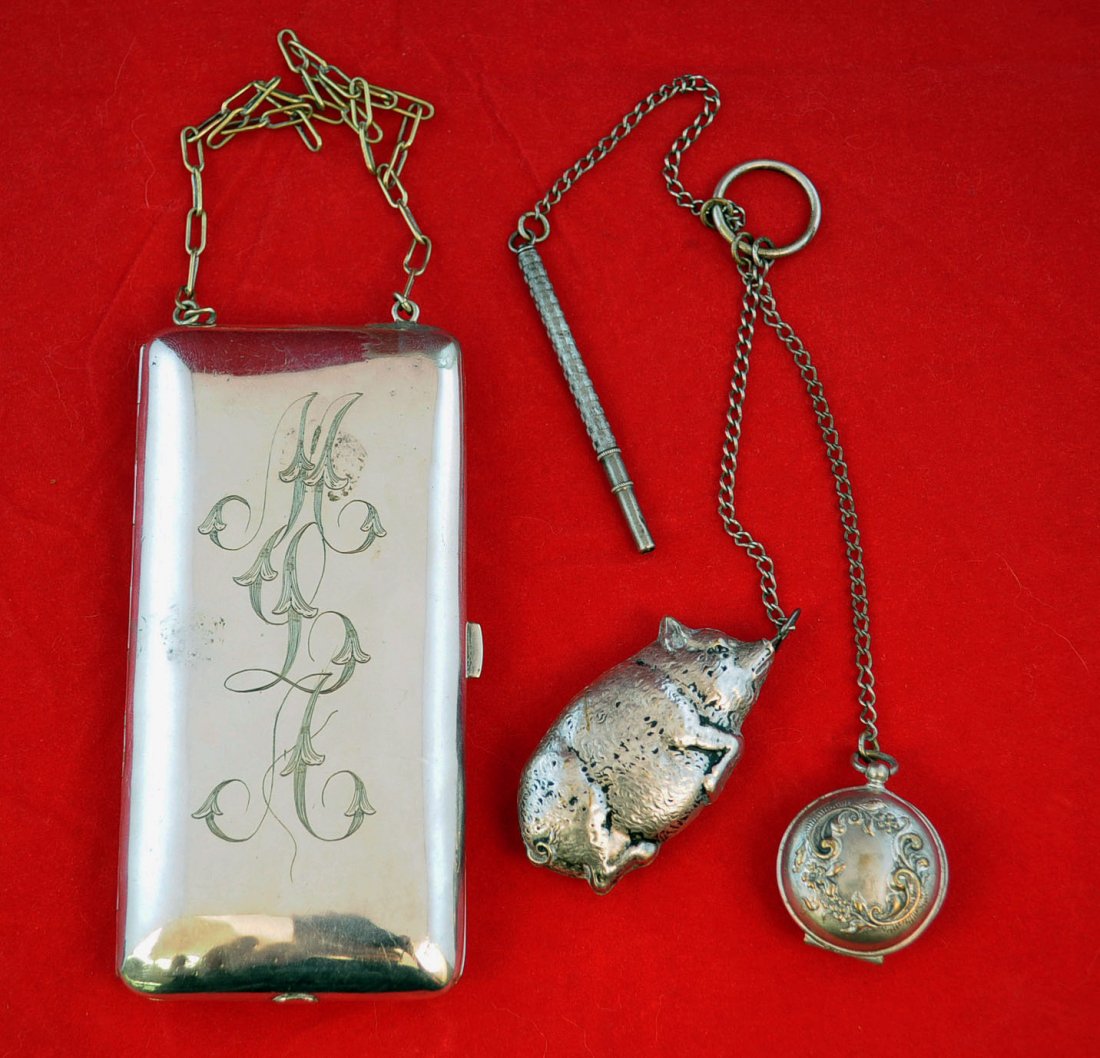 Group of Silver Items Including Pig Tape Measure: Antique German silver money locket & coin case with monogram 2.5" X 5", silver plate pig measuring tape 2.5" L., miniature Sterling silver pencil, silver plate coin holder chatelaine watch fob.
