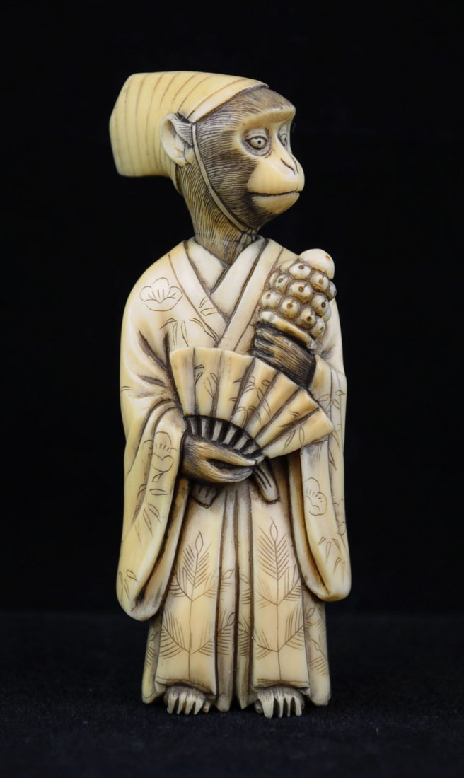 Ivory Netsuke, Monkey Nobleman, Nineteenth Century: Nineteenth century ivory netsuke of monkey nobleman in two joined parts, head and body. Wearing robe, holding fan, sceptre and wearing hat. Signed by the maker. Measures 2.5" H.