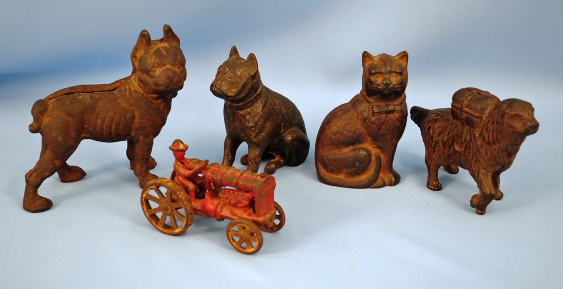 Four Antique Iron Still Banks and Toy Tractor: Four antique Iron still banks. French Bull Dog , St. Bernard, Cat , Boston Terrier and toy tractor. Dimensions - Boston terrier bank is the largest item in the lot - 5.5" L. X 5.25"