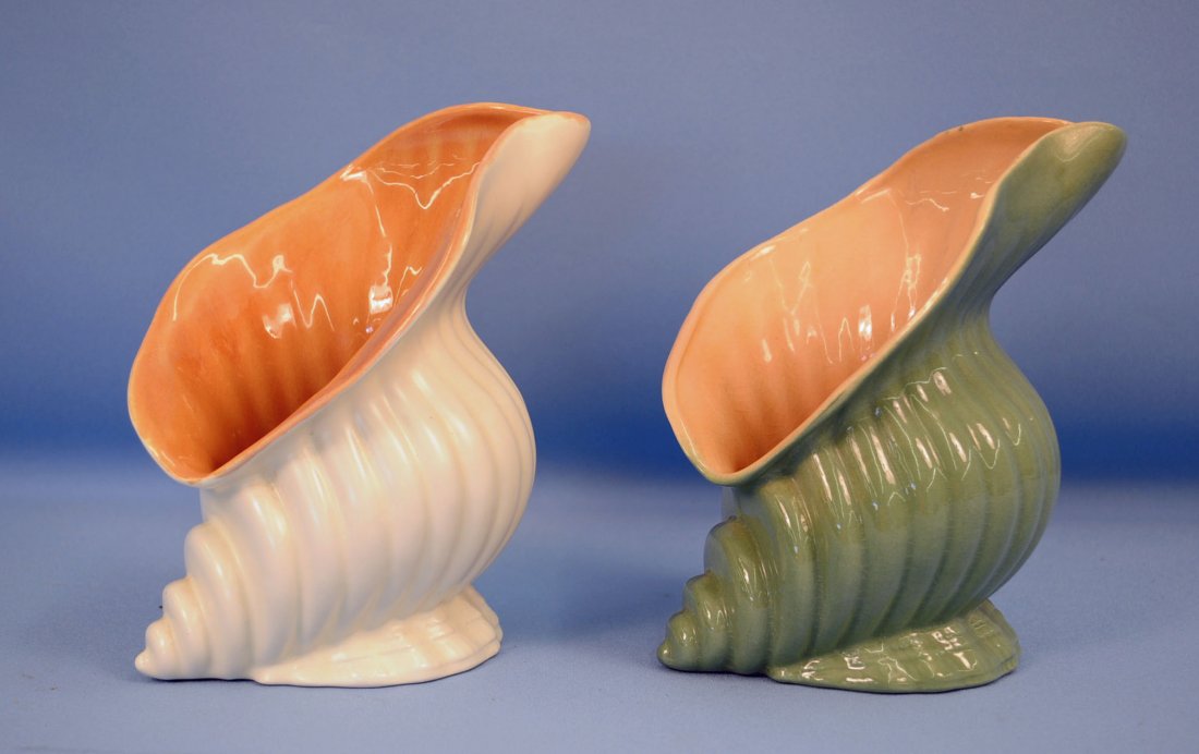 Pair Catalina Pottery, McBean Conch Shell Vases: Pair of Catalina Pottery design by Gladding McBean c.1937-43, Conch Shell Vases in Cream w/ coral and green w/ coral, mold # C353. Green vase is unmarked. Dimensions - 7.5? H. X 6"