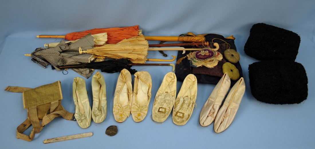 Group of Edwardian ladies Items: Victorian/Edwardian silk bridal shoes Barre Pairs 1889; three draw string bags, one includes vintage box of seasickness pills and travel bool of Paris; three pin cushions; three pairs of Edwardian sil