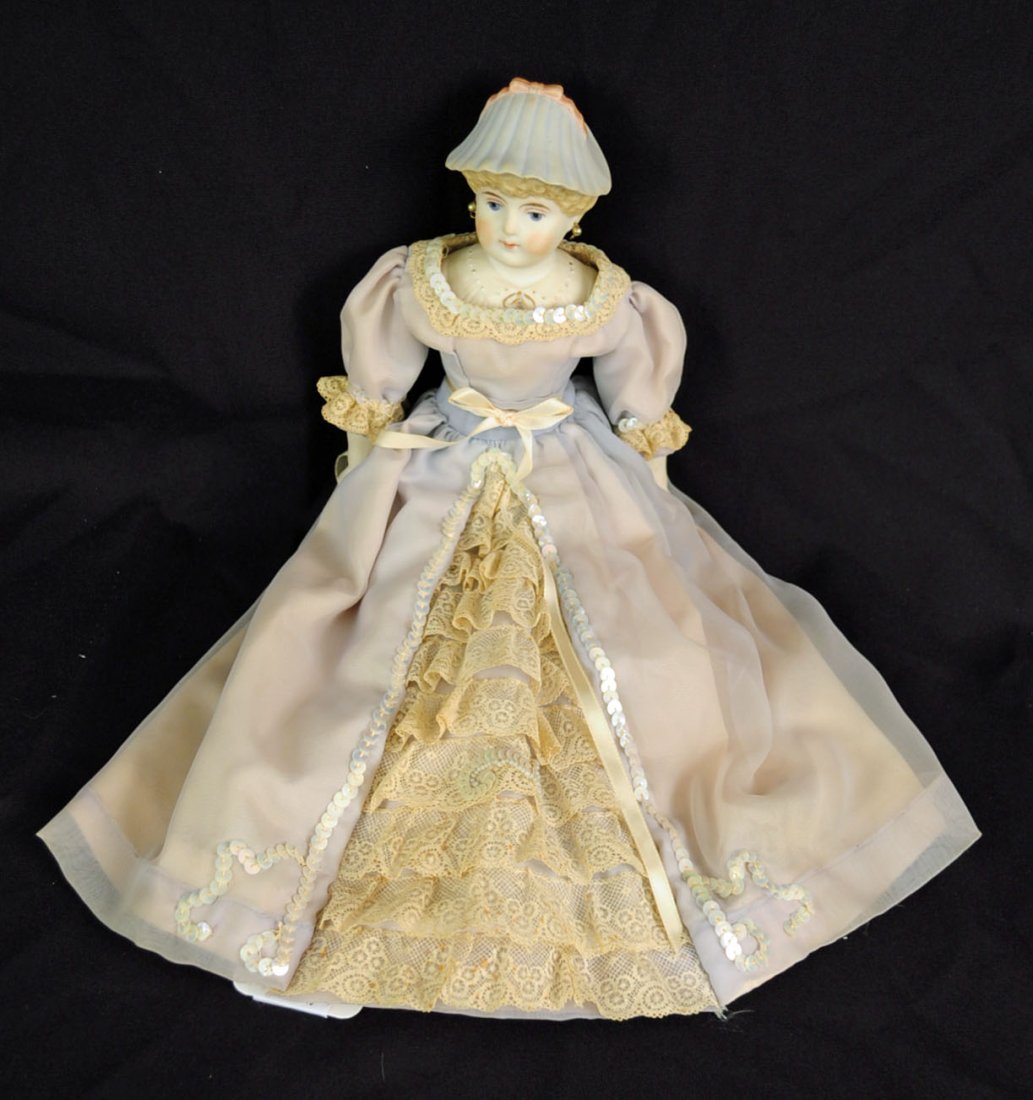 Rare Parian 14.5" Doll Wearing Hat: Rare Parian 14.5" Doll Wearing Hat. Bisque bonnet doll with molded ruffled hat in light blue with rose bow on top, blond painted hair, bisque hand and feet with brown painted shoes and ribbon at top, 