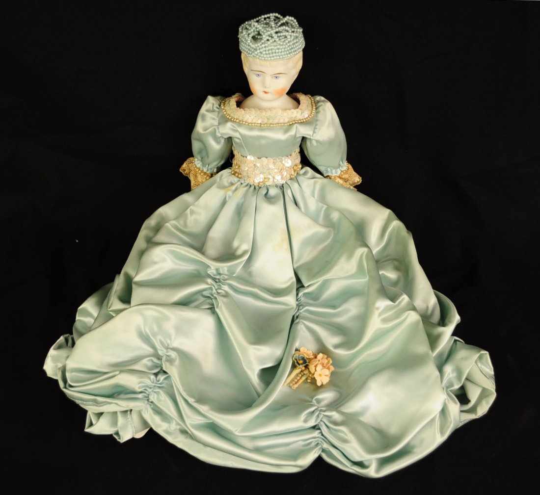 Parian 13" Doll In Aqua Satin Dress: Parian 13" Doll In Aqua Satin Dress. Doll has blonde hair, blue eyes, beaded hat, and is wearing an aqua satin dress.