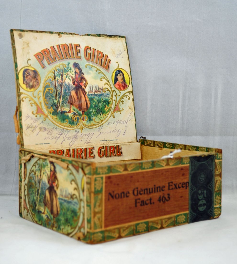 Prairie Girl Wooden Cigar Box: Prairie Girl Wooden Cigar Box. Girl with gun who resembles Annie Oakley. interior of box has beautiful lithograph of Prairie Girl with buffalo and Indian. Lid of box has inscription in ink of a trip t