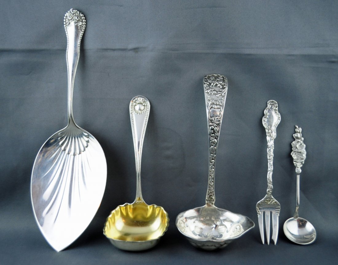 Mixed lot of Sterling Silver Including Ladles: Lot includes; Reed & Barton Harlequin Ladle; Marshall Field Co. Cupid Cream Ladle; Gorham Lancaster 9" inch Pie Server; Durgin Silver Watteau Pastry Fork and Whiting Silver /Gilt Bread Gravy Ladle. To