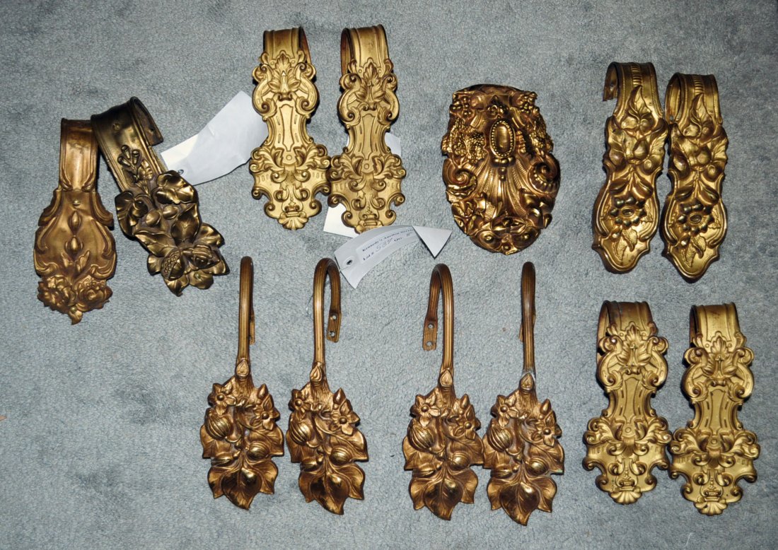 Group of 13 Gilt Victorian Curtain Tiebacks: Group of 5 Matching Pairs of Gilt Victorian Curtain Tiebacks and 3 odd tiebacks. Set of 4 Matching 8" L., Set of 2 Matching 9" L. and 3 Odd.