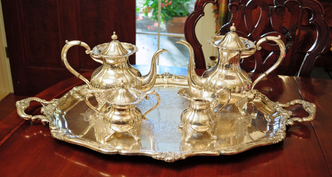 Four Piece Sterling Silver Tea & Coffee Service: Four Piece Sterling Silver Tea & Coffee Service with 8.5" H. Footed Teapot, 9.75" H. Footed Coffee Pot, 4.75" Footed Creamer, 5.5" H. Footed Sugar. Four piece set weighs Sterling Silver 77 Troy Ounces