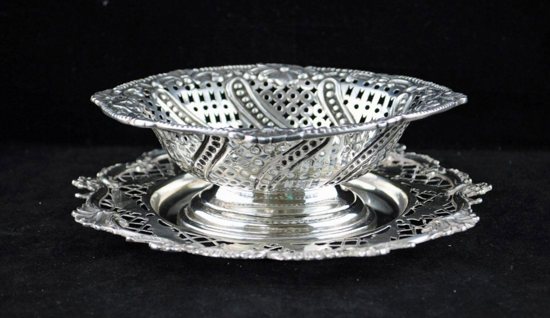 Sterling C. 1800 Tray & Charles S. Harris Basket: Two pieces of sterling silver, C.1800 reticulated tray with a rubbed makers mark, 7" dia. and a Charles Stuart Harris reticulated basket C. 1897, 2.25" H. X 6.25" X 5".